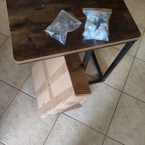 Wooden side table with metal base and wheels