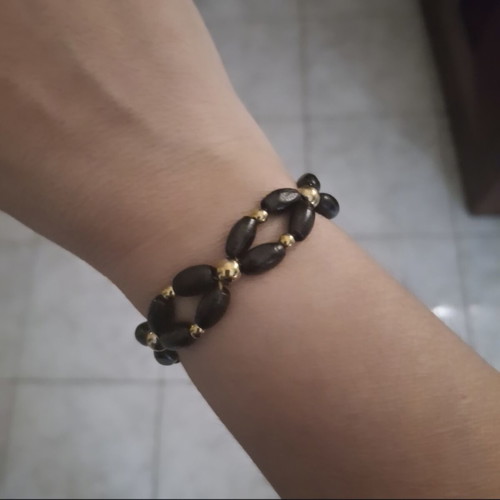 Bracelet with black wooden beads and gold details adjustable, new
