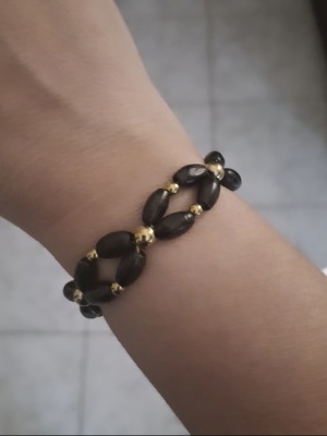 Bracelet with black wooden beads and gold details adjustable, new