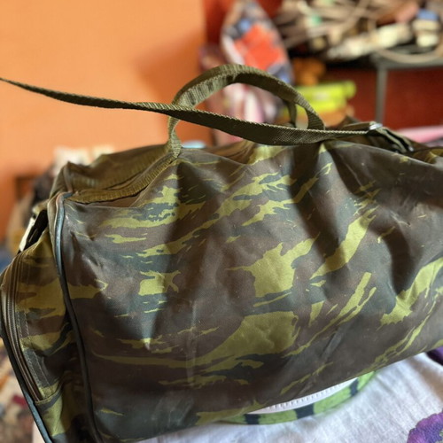 Military camouflage bag with straps used