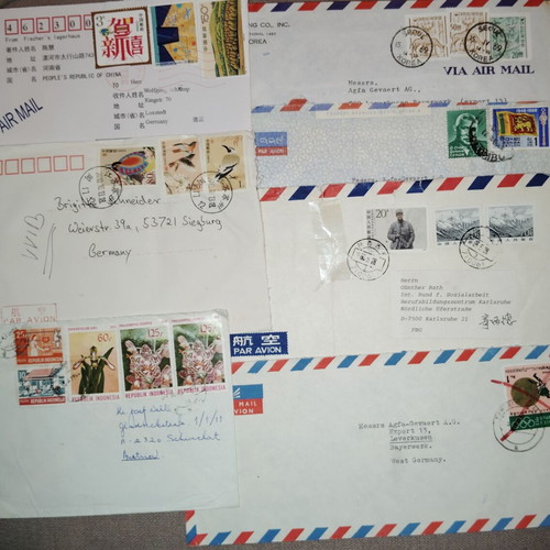 Collection of envelopes and stamps from around the world, new