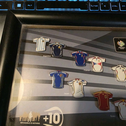 Set of collectible pins with Adidas jerseys like new