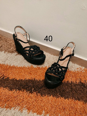 Women's black platform sandals with woven design like new