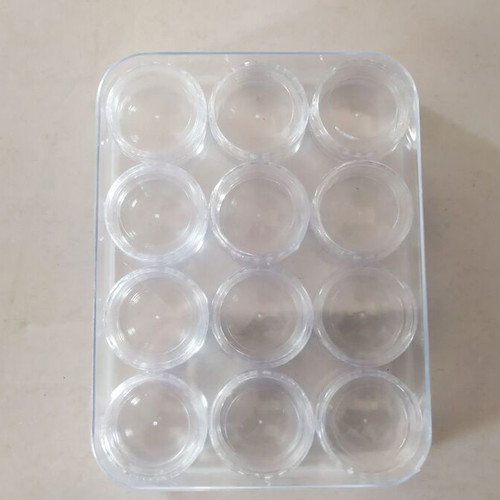Transparent circular capsules like new, box of 12 pieces