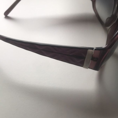 Burberry sunglasses and case used with minor defect