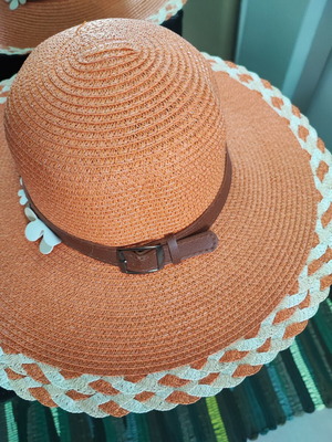Beach hat like new, orange with flower decoration