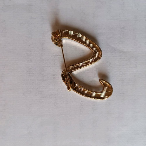Women's pin new with gold design and rhinestones