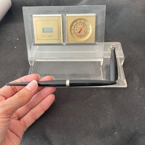 Desk decoration with pen and clock