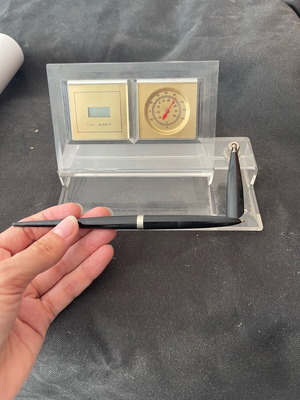 Desk decoration with pen and clock