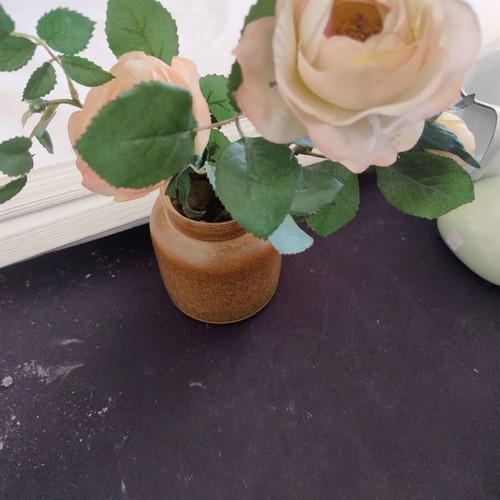 Decorative ceramic vase with artificial flowers used