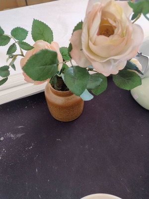 Decorative ceramic vase with artificial flowers used