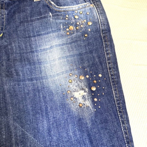 Vintage blue Rococo jeans with studs and rips like new