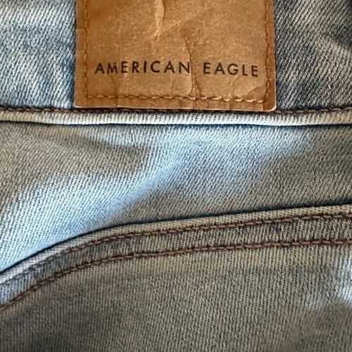 American Eagle stretch jean with rips new size S