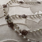 Necklace with pearls and filigree flowers new, length 70 cm