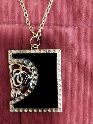 Steel necklace used, black and gold-colored