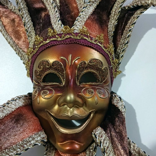 Decorative wall mask like new in burgundy and gold tones