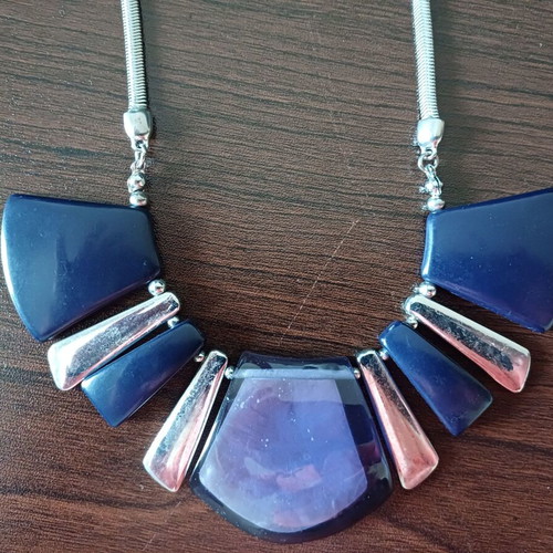 Geometric necklace used with blue and purple designs, Marks & Spencer