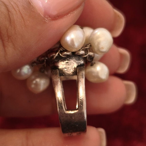 Dyrberg/Kern statement ring used with pearls and iridescent stone