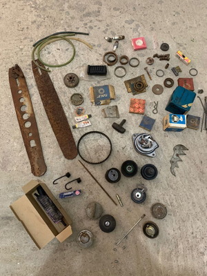 Various old chainsaw and small engine parts used