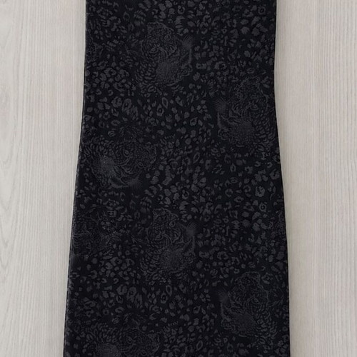 Elastic dress one size with asymmetrical hem, black with grey tiger rhinestones, like new