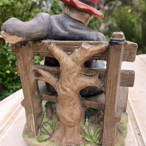Traveler figurine used, missing one hand