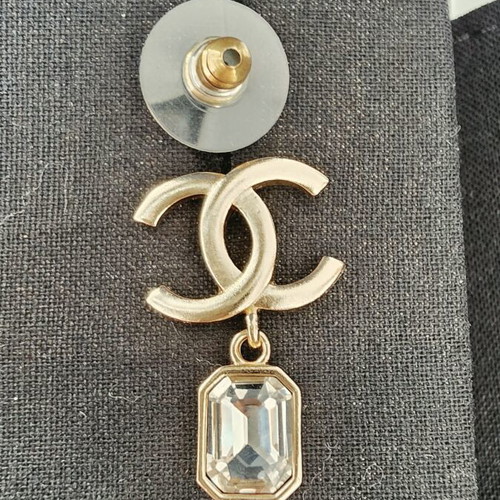 Chanel earrings with white and gold details