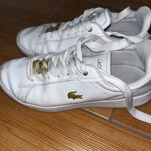 Lacoste sneakers used leather with gold details