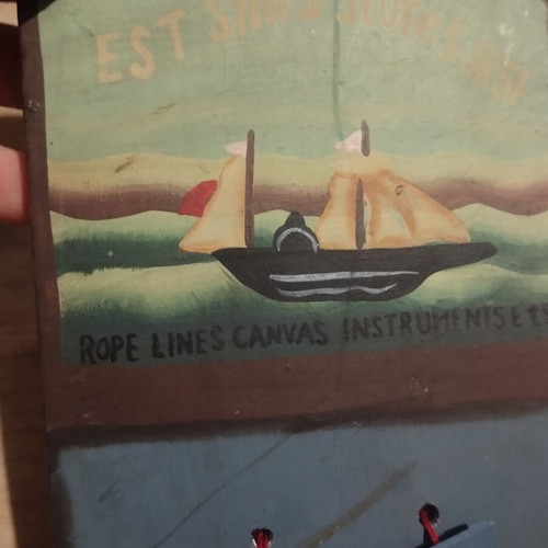Wooden decorative hanging with boat for notes