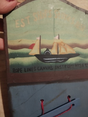 Wooden decorative hanging with boat for notes