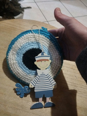 Handmade knitted and wooden decorative eye used