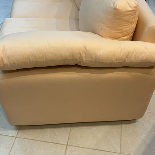 Fabric two-seater sofa used, light pink-peach with side cushions