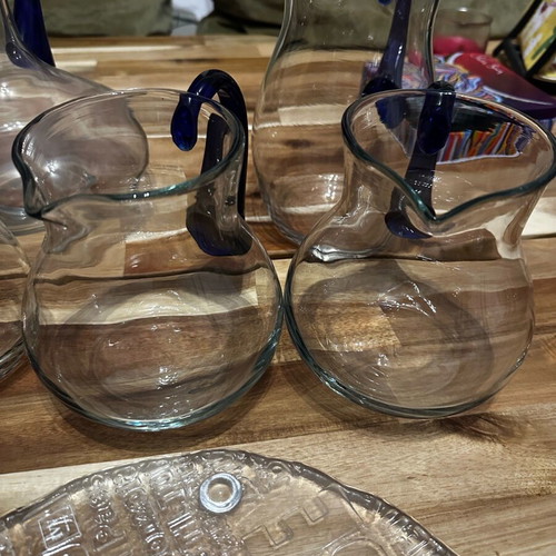 Set of 10 blown glass pitchers like new with cheese platter