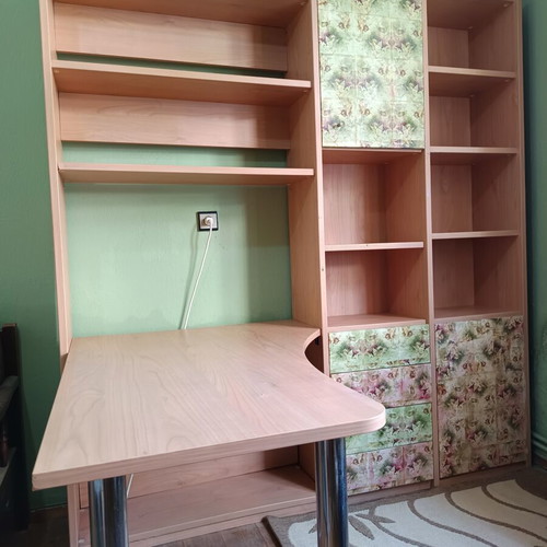Desk with bookshelf and multiple storage spaces used
