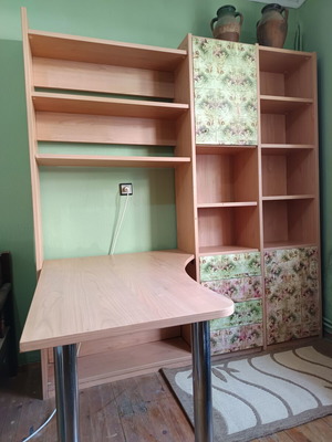 Desk with bookshelf and multiple storage spaces used