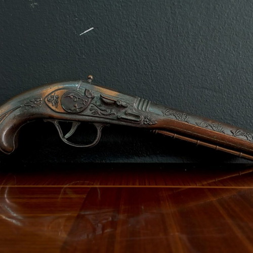 Vintage replica pistol used with engraved designs