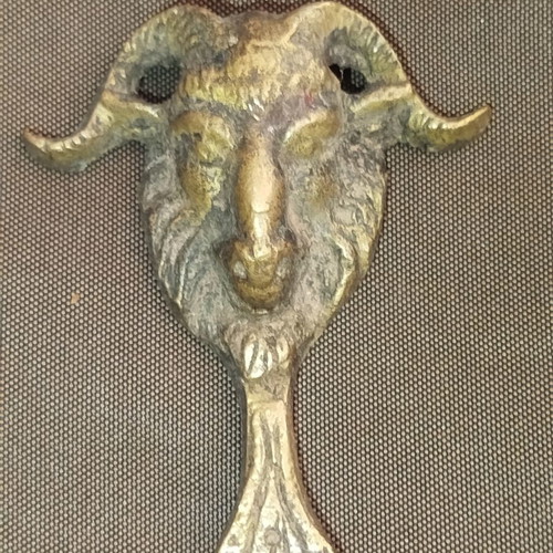 Bronze bottle opener used