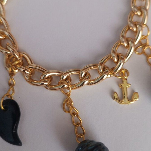 Gold bracelet with charms, new, dark blue details