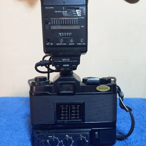 Revueflex AC2 35mm SLR film camera used with Sunpak Auto 26 DX flash
