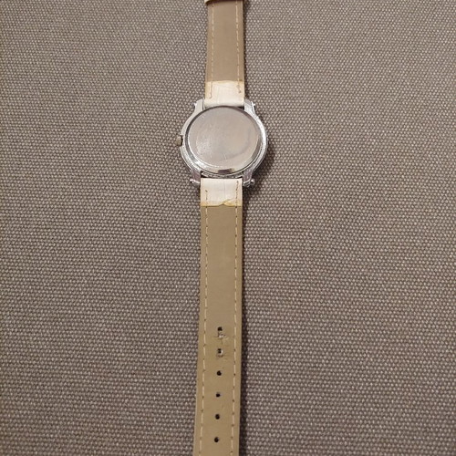 Quartz wristwatch used with crystals and leatherette strap