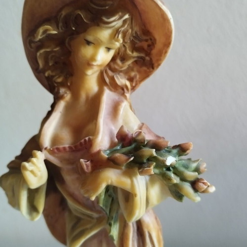 Vintage Italian decorative statue of a girl with roses, used