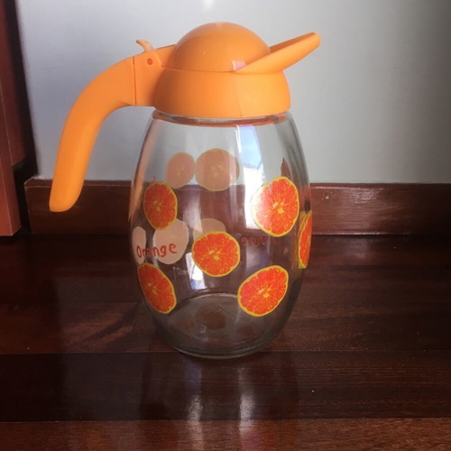 Solmazer jug like new with orange pattern and plastic lid