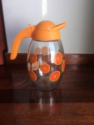 Solmazer jug like new with orange pattern and plastic lid
