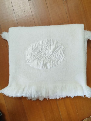 Baby white blanket used with satin decorative applique and fringes