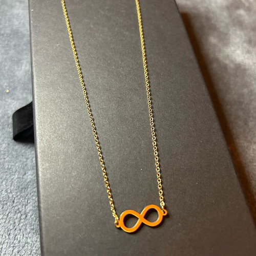 Set of 2 pendants letter M and infinity symbol gold color, new