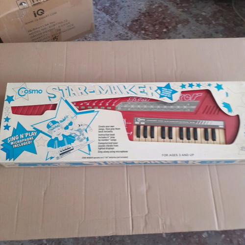 Old piano toy in red color new