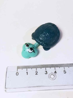 Plastic kinder turtle figure used with marks