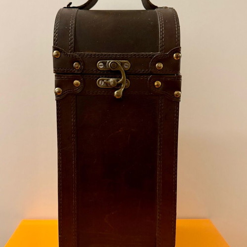 Decorative wooden case used with leatherette for bottle storage