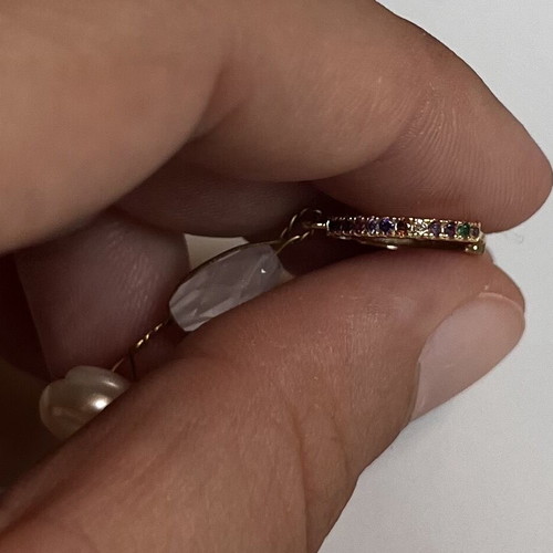 Single hoop earring used with pearl and multicolored stones gold-tone