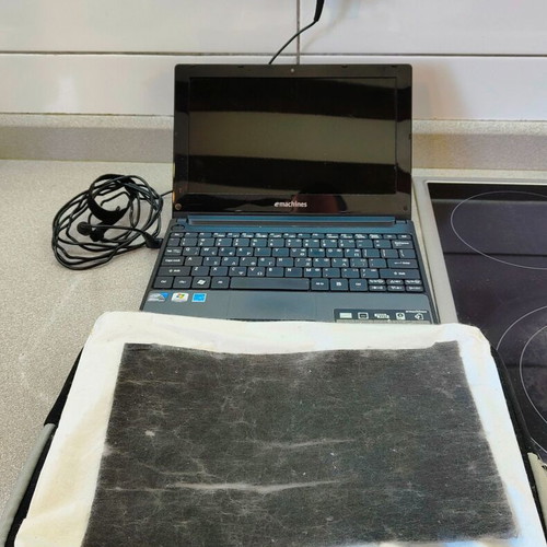 eMachines eM355 netbook 10.1" like new with charger