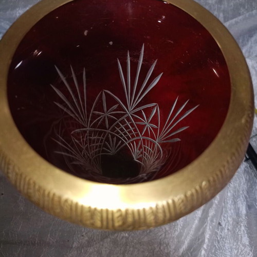 Vintage red glass vase with cut designs and decorative brass base and rim
